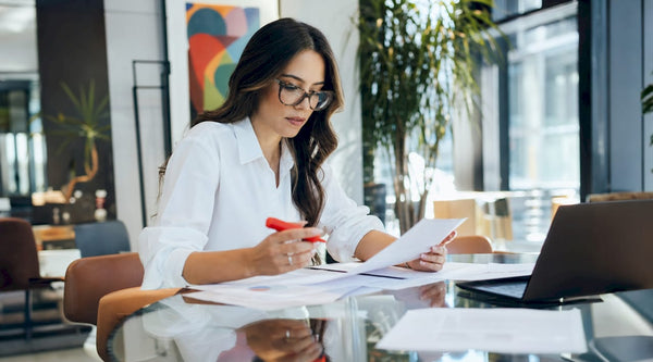 Woman reviewing marketplace compliance documents
