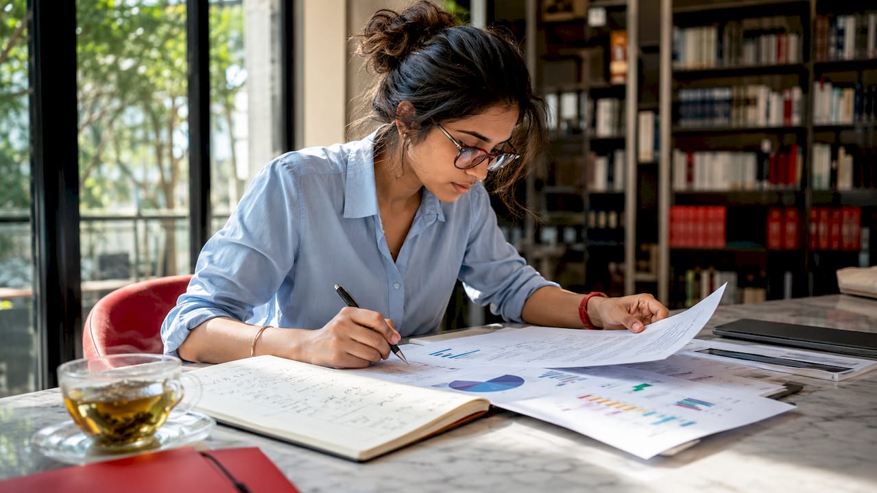 Woman analyzing ecommerce performance reports